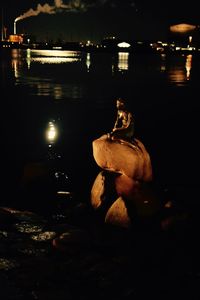 Close-up of illuminated boat in water at night