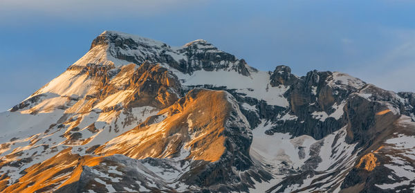 Panoramic view of snowcapped mountains against sky