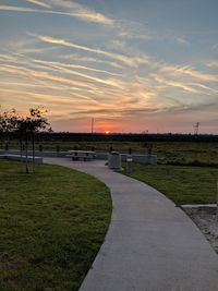 Scenic view of field against sky during sunset