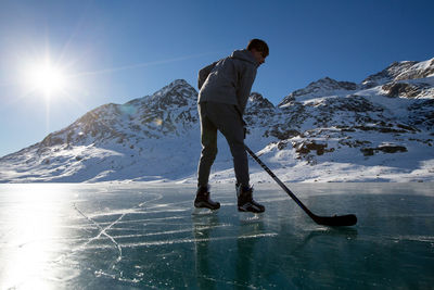 Young man playing ice hockey