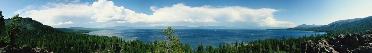 Scenic view of mountains against cloudy sky