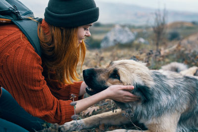 Rear view of woman with dog