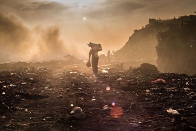 Man walking at landfill