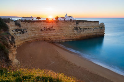 Nossa senhora da rocha church in algarve at sunset, portugal