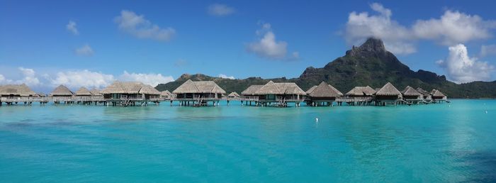 Panoramic view of sea against blue sky