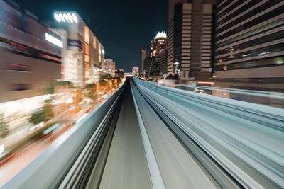High angle view of light trails on road at night