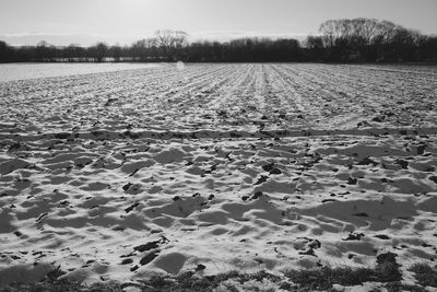 Scenic view of snow covered land