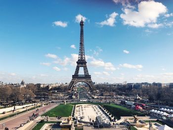 Eiffel tower against cloudy sky