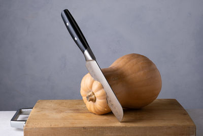 Cropped hand of person cutting board