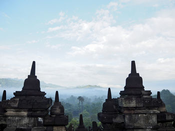 View of temple against cloudy sky
