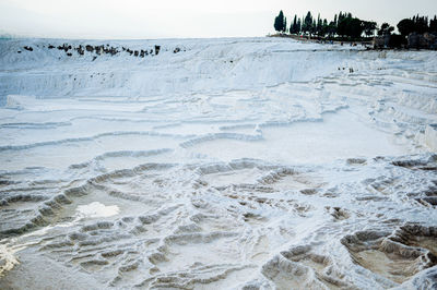 Scenic view of sea against sky during winter