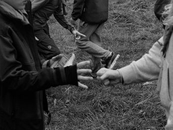 Midsection of man on field