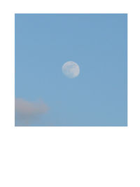 Scenic view of moon against blue sky