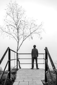 Full length of people on railing