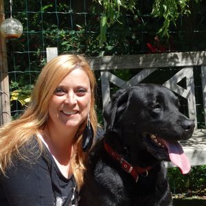 Portrait of smiling young woman with dog