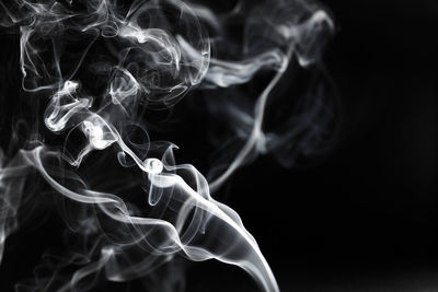 Close-up of smoke against black background