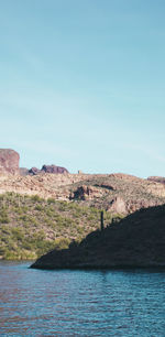 Scenic view of mountains against clear blue sky