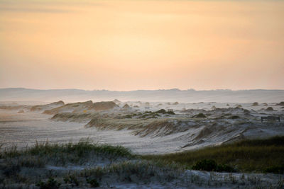 Scenic view of sea at sunset