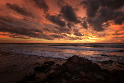 Scenic view of sea against sky during sunset
