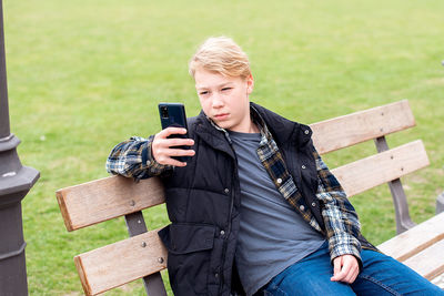 Teenage boy using smartphone