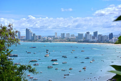 Scenic view of sea and buildings against sky