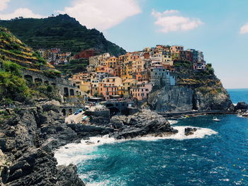 Buildings on rock formations by sea