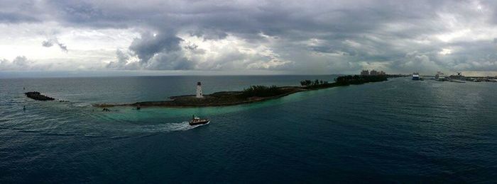 Scenic view of sea against cloudy sky