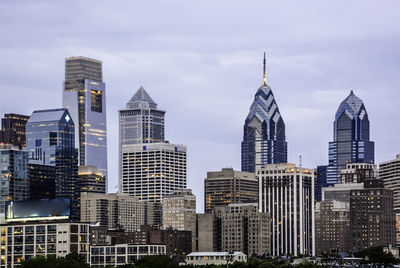 City skyline against cloudy sky