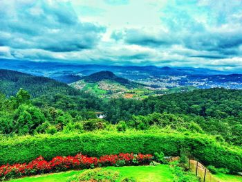 Scenic view of landscape against cloudy sky