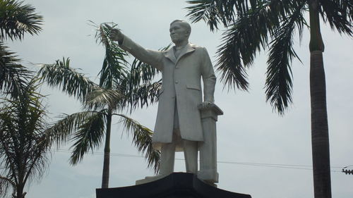 Low angle view of statue against sky