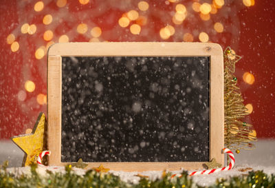 Close-up of blackboard during christmas