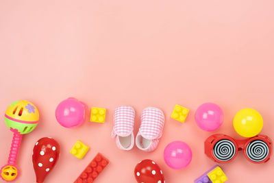 High angle view of multi colored toy against gray background