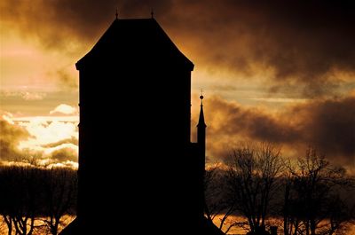 Low angle view of building against sunset