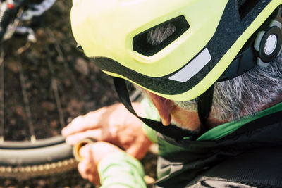 Close-up of man holding leaf