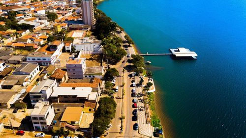 High angle view of buildings by sea