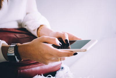 Close-up of man using mobile phone