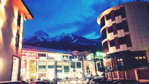 Low angle view of illuminated buildings against sky