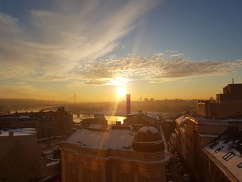 High angle view of buildings against sky during sunset