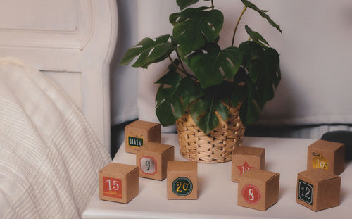 Advent calendar boxes with numbers on the bedside table.