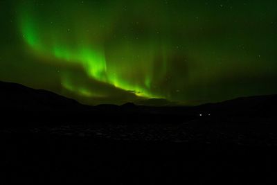 Scenic view of mountains against sky at night