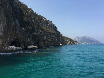 Scenic view of sea against clear blue sky