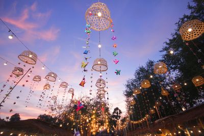 Low angle view of illuminated christmas decoration against sky