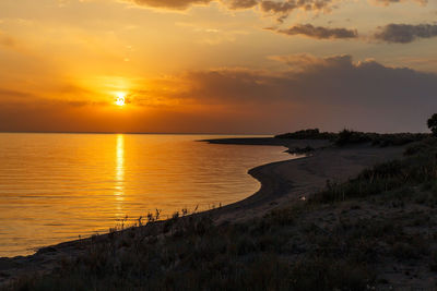 Scenic view of sea against sky during sunset