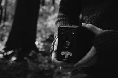 Close-up of hand holding camera