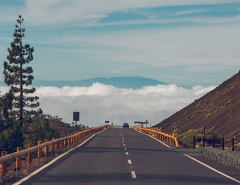 Bridge over road against sky