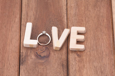 Directly above shot of text on wooden table