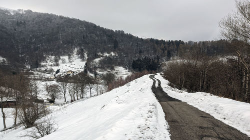 Scenic view of snow covered mountain against sky