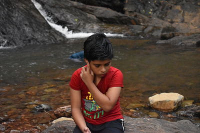 Teenage girl looking at river