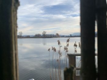 Scenic view of lake against sky during sunset