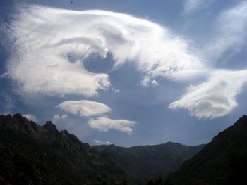 Low angle view of dramatic sky over land